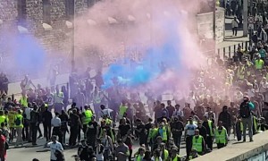 Yellow vests in Paris set fires on march route in latest protests