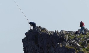 Spanish fishermen risk their lives catching sea bream from top of steep cliff