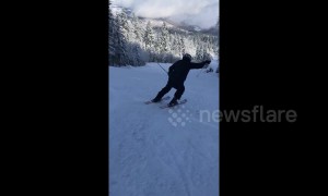 Ski instructor gives screaming encouragement to student in Bosnian mountains