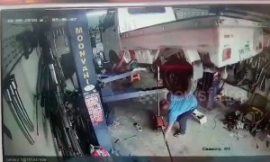 How NOT to fix a car! Funny moment bungling mechanics drop truck