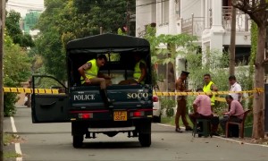 Police work outside expensive home of two of the Sri Lanka attackers