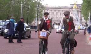 Scores of people ride through London dressed in tweed