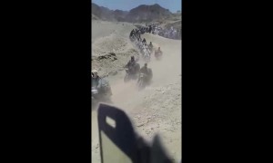 Huge line of fuel smugglers cross the border from Iran into Pakistan