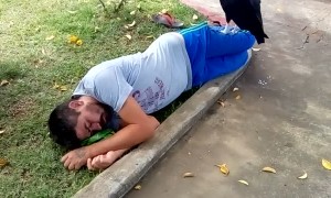 Vulture Sits on Sleeping Man