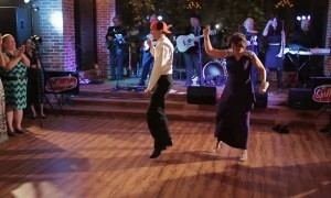 Mother and son pull of synchronized wedding dance