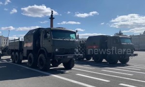 Russian military tanks parade through St. Petersburg's Palace Square on Victory Day