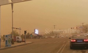 Massive sandstorm turns Chinese city skies dark yellow