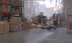 Fighter Jet Just Crashes Through Warehouse Wall