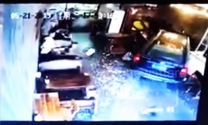 Mother and son escape injury after a car smashes into a restaurant in China