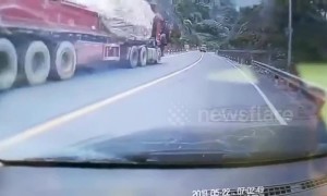 Heroic car driver jumps into driverless lorry to stop it from sliding down Chinese highway