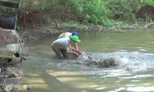 Thai villagers race to save giant catfish from drought-ravaged reservoir