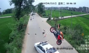 Motorcycle flips through the air after head-on car crash, throwing rider onto bonnet