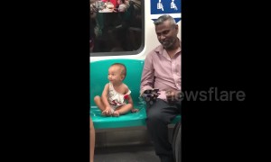 Heartwarming moment man and little girl watch 'Tom & Jerry' on train in Singapore