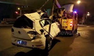 Car falls off 30-foot-high overpass after dramatic crash in Shanghai
