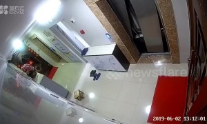Elevator doors in Chinese apartment suddenly crash open after stone gets stuck inside