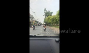 Thai motorcyclist arrested after standing on the seat while speeding down motorway