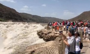 Spectacular Hukou Waterfall on Yellow River in full flow after rainfalls