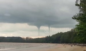 Rare double waterspout amazes beachgoers in southern Thailand