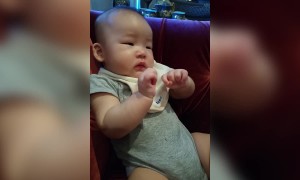 Baby has First Taste of Apples