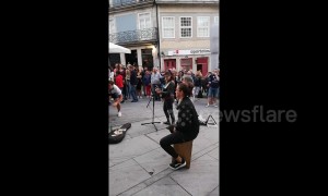 England fans sing with busker in Porto and receive guard of honour from locals