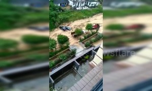 Flash floods cause massive landslide which sweeps away vehicles in southern China