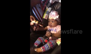 Cute hungry baby excited to try her first rib