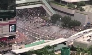 Hong Kong police fire tear gas into crowd of protesters