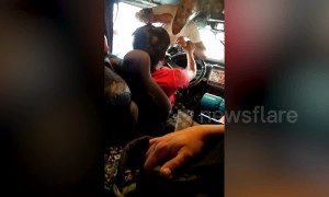 Furious wife confronts cheating husband as he drives bus in the Philippines