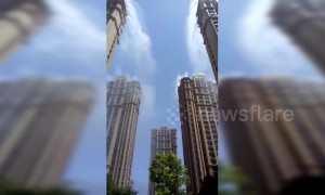 Chinese residential community sprays water from skyscrapers to combat heat wave