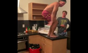 Dude does front-flip onto kitchen floor, acts like it's no big deal