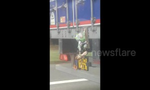 Woody and Buzz hang off UK truck decorated with 'Toy Story' characters