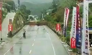 Massive landslide in China blocks highway seconds after motorcyclist drives past