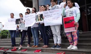 Bolivian activists place shoes outside court in protests at sexist killings