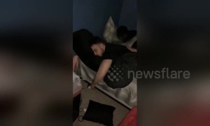 Drunk man dances lying in bed thinking he’s still at the club