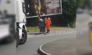 Heartwarming moment as truck driver stops to help little old lady cross road
