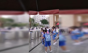 Chinese pupils scan faces at facial recognition gate to enter school