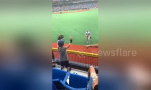 Heartwarming moment baseball player Mike Trout throws a ball to an excited little boy