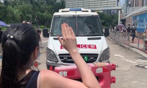 Hong Kong protesters block police van