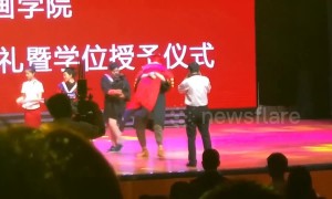 Excited graduate in China falls over on stage with university president in his arms