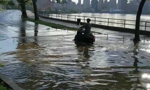 Delivery Driver Makes the Most of Flooded Street