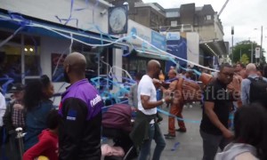 Performers wielding giant paper tissue guns completely cover London bar