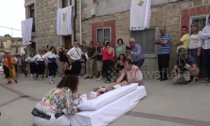 Men jump over babies and whip locals in bizarre yet entertaining Spanish festival