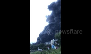 Huge clouds of black smoke rise from fire at industrial plant in Spain's San Roque