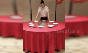 Hotel employee in China shows off incredible table setting skills