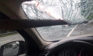 Flying iron bar impales a car windscreen on Chinese motorway
