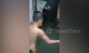 Homes submerged in water after heavy rain causes floods in the Philippines