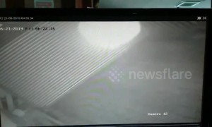 Spooky glowing 'ghost' captured on CCTV trapped inside car park