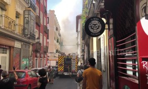 Firefighters on the scene as they attempt to extinguish flat fire in Madrid