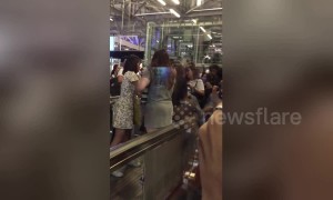 Fans of K-pop act NCT 127 grapple with airport security to enter first-class lounge