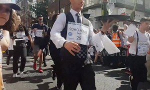 Waiters in London's Soho compete in traditional champagne street race